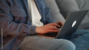 IT profession. A man works in an office at a laptop. Remote work from home. Online shopping. Office worker with computer