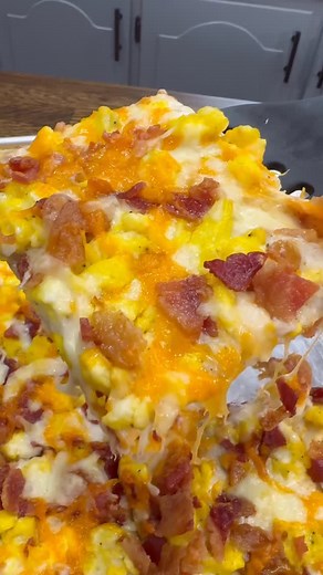 Luke Brown on Instagram: "Sheet Pan Breakfast Pizza is easy to make at home and freezes/reheats well making it an awesome breakfast prep! INGREDIENTS 2 packages of Pizza Crust + ingredients needed to make pizza crust Gravy (3 tbsp butter, 3 tbsp flour, and 2 cups of milk) 8-10 pieces of bacon 4 eggs scrambled Shredded cheddar cheese Shredded Mozzarella cheese Salt and pepper INSTRUCTIONS Cook bacon in the oven at 400 degrees F on a sheet pan lined with parchment paper. Bake for 20-25 minutes. Mi
