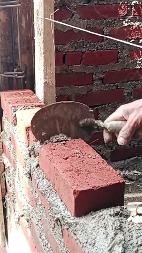 installing brick for building.