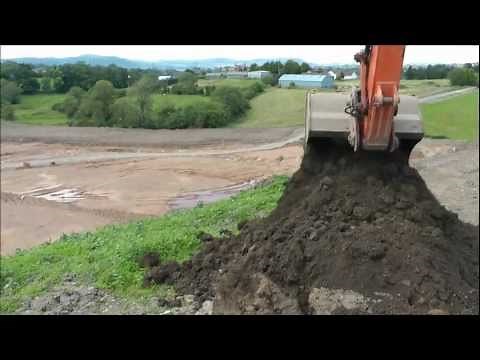 Excavator digging a hole ( multi - angle)