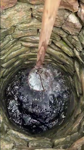 The process of filling bucket with well water