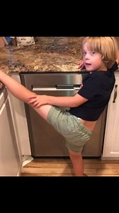 Wil's flexibility never ceases to surprise me. when he was young he would randomly put his leg up Jean-Claude Van Damme style on the counter while he was chatting with us. I know that since children with Down Syndrome have low muscle tone they can pretty much do the splits without even trying but do they become less flexible as time goes on? All of you friends with older kids please share your knowledge #downsyndromebaby #yogamaster #kidyoga | That Dad Life