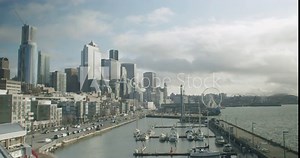 Boats And Yachts Anchored At The Pier-66 Near The Seattle Waterfront And Great Wheel By The Elliott Bay In Seattle, Washington, USA. - static shot