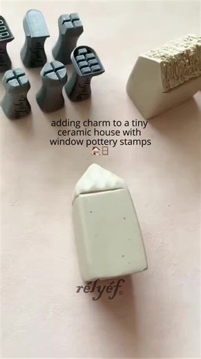 Adding charm to a tiny ceramic house with window pottery stamps! 🏠✨ Watch the details come to life. Buy your set of window stamps here: https://relyefpotterytools.com/products/window-stamps?variant=52414596481373 pottery stamps | pottery | clay stamps | ceramics | ceramicart | handmade | handcraft | beginnerpotter | pottery tools #pottery #potterytiktok #potterystamps #clay #clayart #claystamps #ceramics #ceramicsoftiktok #ceramicart #beginnerpottery #claytools #potterytools #potteryvideos #pot