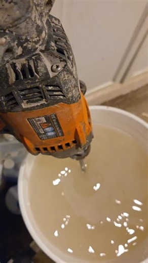 Mixing syrup for feeding hives that feel "light." First close the bulkhead drain at the bottom of a 5 gallon mixing bucket. Then fill the bucket with 2 inches or so of hot water. Next add 25 pounds of cane sugar. Add hot water to fill the bucket within an inch of the top and mix for two minutes with a paddle or "mud" mixer. Add water as needed to make 2 gallon Open the ball valve on the bottom drain line to fill the 5 gallon carboy. Drains in under 30 seconds. The result is 50 pounds of syrup in