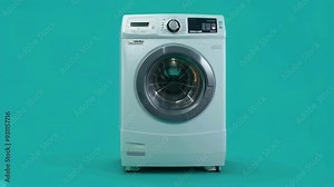 A modern front-load washing machine set against a teal background, emphasizing its design and functionality for household laundry tasks.
