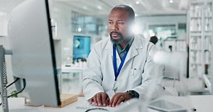 Black man, doctor and typing on computer in lab for medical research, experiment report and results information. Serious, scientist and pc for test feedback, innovation and pharmaceutical development