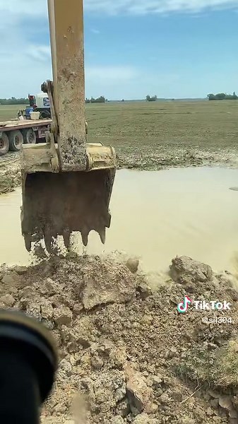 Excavator Digging in Open Field: Watch this Heavy Machinery