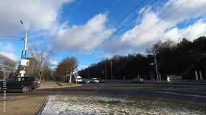 Cars and public transport ride in the city at the intersection of the avenue and the asphalt road. Minsk. Belarus - January 24 2020