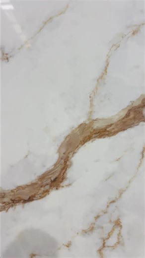 Calacatta Quartz features a crisp white base with elegant, flowing veining, bringing timeless luxury