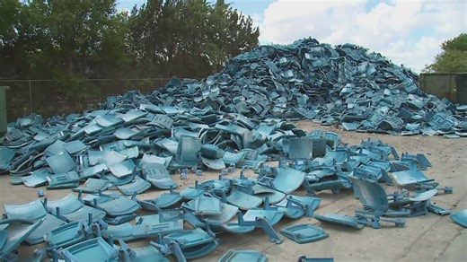 Removed EverBank Stadium seats piled high at Jacksonville recycling center