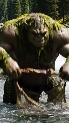 Mystical troll wading in a rushing river, fantasy creature in natural forest habitat