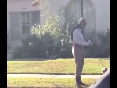 Woman Picks up dog poop with face mask and puts mask back on.