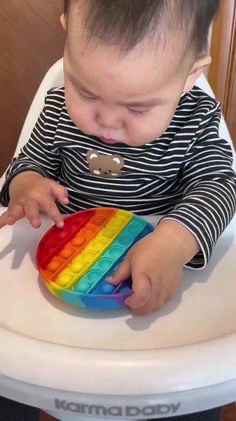 Engaging Toddler Sensory Play with Pop-It Toy