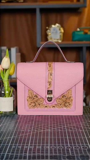 Pink leather bag with hand-carved floral details. #handmadebag #bag #usa #handbag #custom #craftman