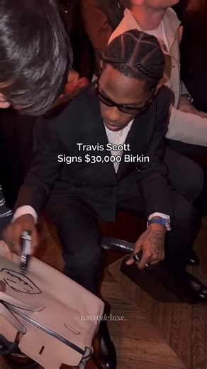Ultimate Handbag & Shoe Care on Instagram: "Travis Scott sitting front row at the Hermès Paris Fashion Show… and signing a $30,000 Birkin. A collector’s dream for some. A hard no for others. Is a signature like this a once-in-a-lifetime moment - or something you’d never do to an iconic bag? Would you let Travis Scott sign your Birkin? #travisscott #parisfashionshow #purseaddict #birkin #parisfashionweek #hermesaddict #birkin35"