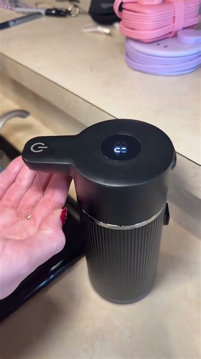 This automatic soap dispenser makes hand washing easy