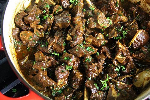 Get my cookbook @ http://www.CaribbeanPot.com/cookbook/ Learn how to make ICONIC Stew Goat as it's done in the Caribbean, with simple step by step instructions from Chris De La Rosa of CaribbeanPot.com Goat meat is seasoned with fresh herbs and spices, marinated and then slowly braised in a rich coconut base, for what is the Ultimate Stewed Goat. For this goat #recipe, you'll need... 4 lbs goat (with bones) 3/4 tablespoon salt 1 onion 2 heaping tablespoon green seasoning 4-6 drops Angostura bitt