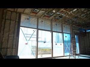 Loewen Lift & Slide Doors inside a Curtain Wall Window System