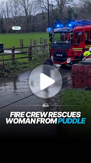 Onlookers have expressed disbelief after a fire engine had to be called out to rescue a driver stuck in a 'puddle' on a country road. Video footage emerged last week of firefighters being summoned to save the woman who became stranded in shallow flood water in Hall Green, Birmingham. #birmingham #fireman #flooding