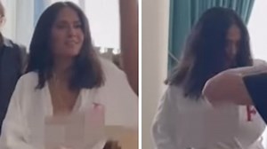 Salma Hayek accidentally flashes breasts in bathrobe