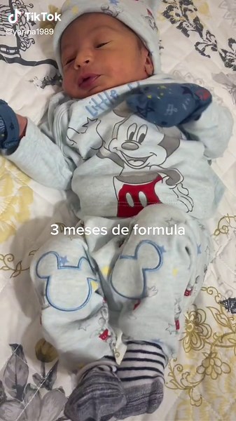 Adorable Baby in Mickey Mouse Outfit Enjoys Playtime
