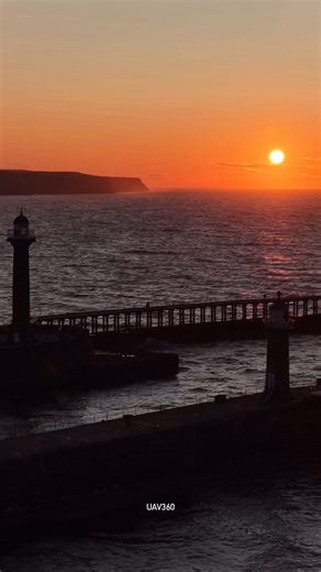 7.9K views · 284 reactions | A beautiful video captured by a drone, as it soared into the golden skies above Whitby, with the sun dipping behind the iconic twin lighthouses and bathing the harbour in warm light. Waves rolled in, the sky turned fire-orange, and Whitby revealed why it’s one of the most breathtaking spots on the Yorkshire coast. ⚓❤️  UAV360  | The Whitby Guide | Facebook