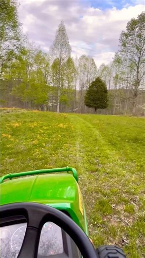 Mowing the back stretch for the first time this Spring
