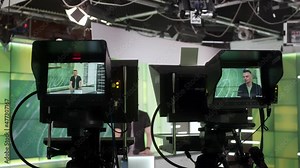 News Studio Anchor Reporting on the Events of the Day. TV Broadcasting Channel. TV studio backstage video recording 4K