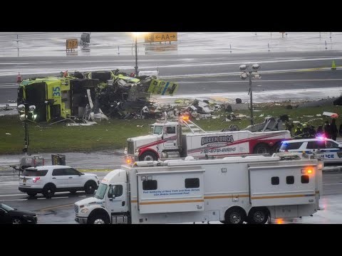 Flight attendant found buckled into seat outside plane after LaGuardia crash