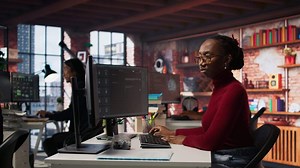 Software development agency expert solving tasks with AI LLM chatbot answering prompts. Startup company employee using computer to interact with large language model program, camera A