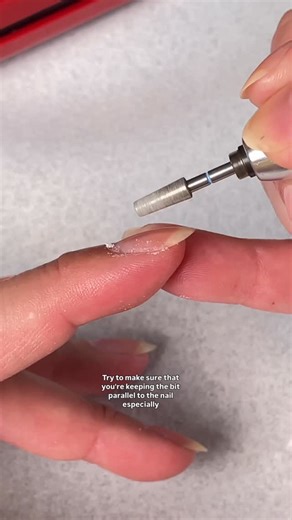 Sigourney Nuñez on Instagram: "Bad confession: I’ve been over prepping my nails 😩 So I’m putting the nippers DOWN and revisiting a super gentle e-file prep technique that gently exfoliates the cuticle area and buffs away dead skin. Would you try this? Prep bit: very fine diamond tapered bit @ericasata E-file: @kupainc Cuticle oil: pistachio oil @lightslacquer #efileprep #nailprep how to prep nails"