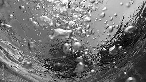 Bubbles rising to the surface. Air bubbles in water in swimming pool (underwater shot), good for backgrounds. Slow motion. Stock Video