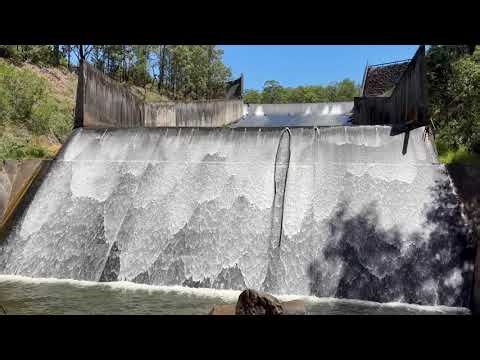 Roll waves in slow motion