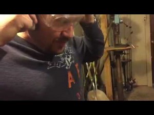 Cutting open a clam fossil with a diamond saw