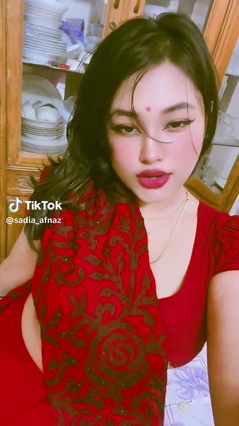 Elegant Red Saree Styling in a Cozy Kitchen