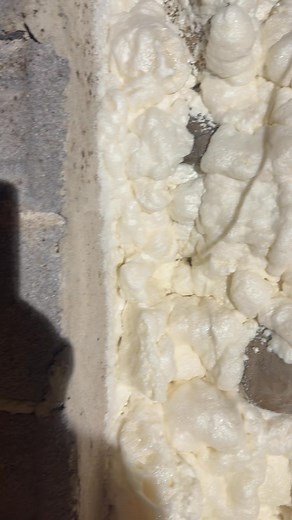 DIY spray foam kit on a rubble rock wall. Worked great | Heidi's Homes