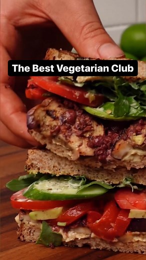 This vegetarian club sandwich—piled high with hummus, grilled veggies, avocado, roasted red peppers and a tangy mayo spread—might be the best sandwich you’ll ever have: https://bit.ly/3YUBLGw | EatingWell