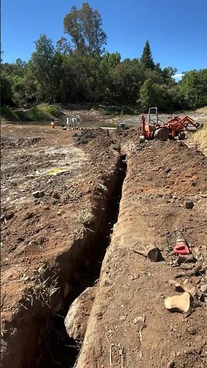 Digging a utility trench for the new irrigation system