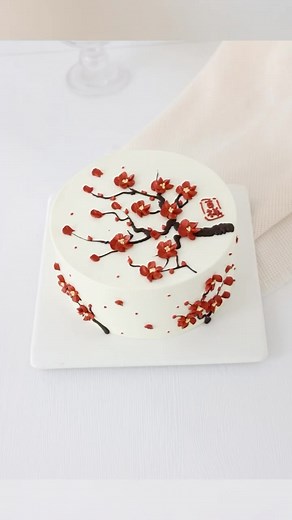 22K views · 185 reactions | Delicate hand-painted plum blossoms bloom gracefully on this cake, capturing the timeless beauty of traditional Chinese artistry. #birthdaycake #dessert#cake#customcake #cakedecorating#cakedesign#style#bread#creativecake#foodexploration#pearlcake#freshandsimple#party#coffee#fancycake#prettycakes#cakesofinstagram#eggfreecake#foodie#cakestagram#babyshowerideas #buttercreamcake #baby #Christmas#eggfreecake #wedding | Piece of Cake Fine Bakery and Cafe | Facebook