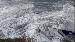 Large storm surge wave crashes over concrete platform, Tramore Ireland