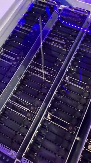 TMG Core single-phase liquid immersion computing tank with several Dell servers swimming inside.