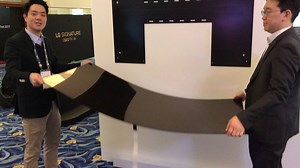 This is the LG Signature Wallpaper OLED in action. This impossibly thin TV hangs on your wall via magnets! Check out our hands-on impressions here: http://bit.ly/2kmo3wc | Stuff Magazine UK
