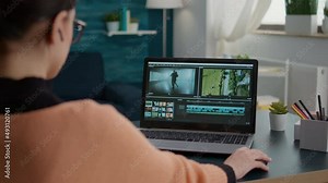 Design student working on video editing software to make montage, creating film for movie footage production. Content creator using multimedia assignment for online school class.