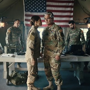 Marine Colonel Demanded Her Call Sign — When She Said “Phantom Seven,” He Froze in Shσᴄκ The ops tent was all canvas breath and generator hum, maps pinned under knives, a U.S. flag stirring the warm air like a reminder someone had sewn into the room: this is where decisions become names on reports—or don’t. She slipped in quietly, helmet tucked under her arm, dust on her boots, the kind of Marine the noise never seems to notice until the room goes still around her. It did. Heads turned. Voices c