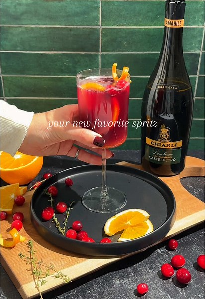 Lambrusco is a sparkling red wine from the Emilia-Romagna region of Italy. Use it in place of prosecco in a classic spritz with complementing flavors of aperol and orange. It is a refreshing and gorgeous drink that is easy to batch for a crowd. The perfect spritz for the holiday season! #lambrusco