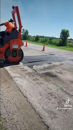 Asphalt Patch being rolled on a 2-Lane Road