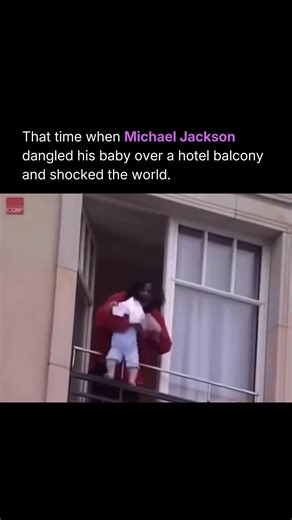 Morbid | Facts | Stories on Instagram: "Outside Berlin’s Hotel Adlon in 2002, Michael Jackson stepped onto a balcony to greet fans and in a moment that stunned onlookers, briefly held his infant son over the edge. The footage spread instantly, cementing itself as one of the most disturbing celebrity images ever captured. Jackson later said he was trying to show his child to fans and insisted he was in control, but the visual told a different story. A baby wrapped in a blanket. A steep drop below