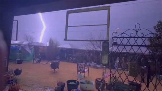 Hailstorm and lightning strike captured during a storm in Crowley, Texas, USA