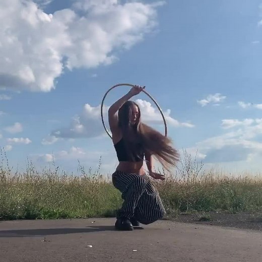 Girl Performs Dance Routine With Hula Hoop